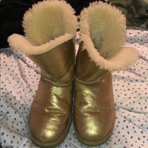 Gold short bailey button Ugg boots.